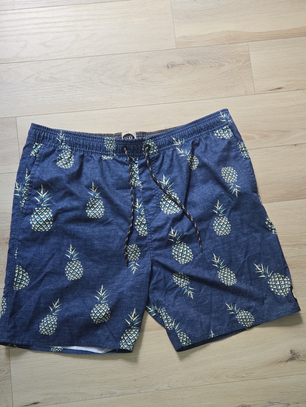 Rip Curl Navy Swim Trunks with Yellow Pineapple Print